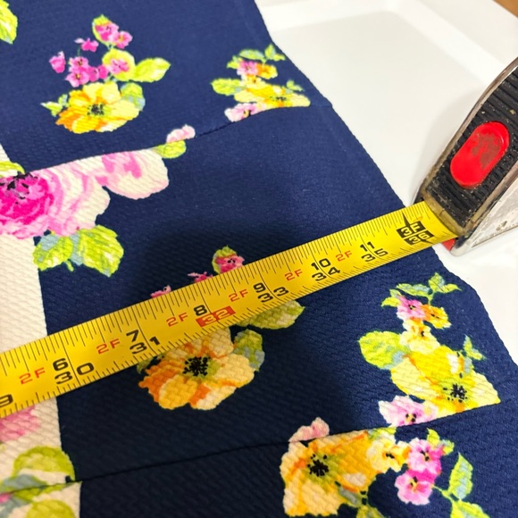 Emma & Michele floral cap-sleeve dress on a navy blue/white striped background. - Picture 10 of 12